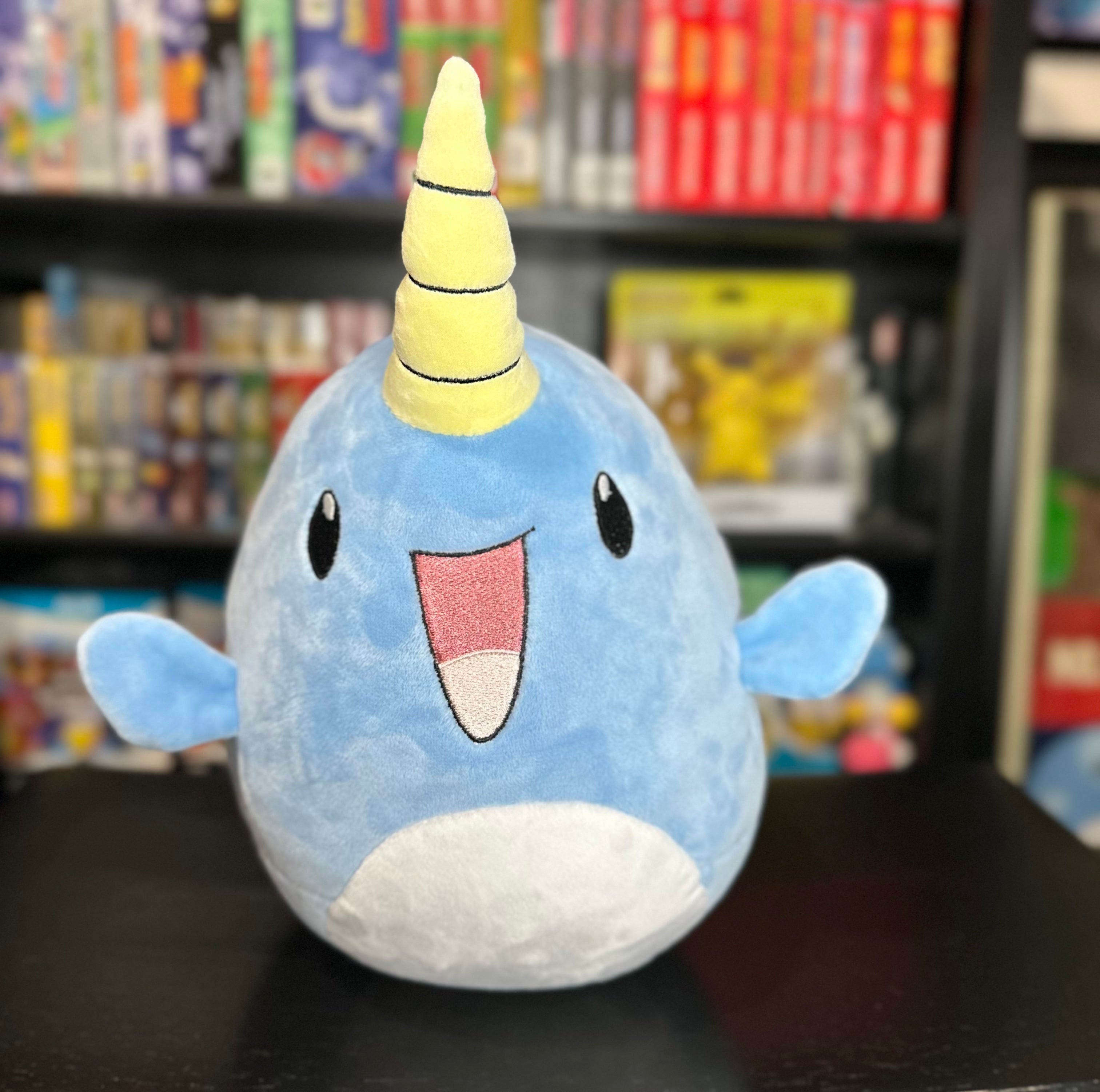 Narwade plush from Histrobea Chronicles, a cute blue narwhal character with a yellow horn and a happy expression. This collectible plush toy is part of the HoopsandHipHop YouTube channel's brand lineup.