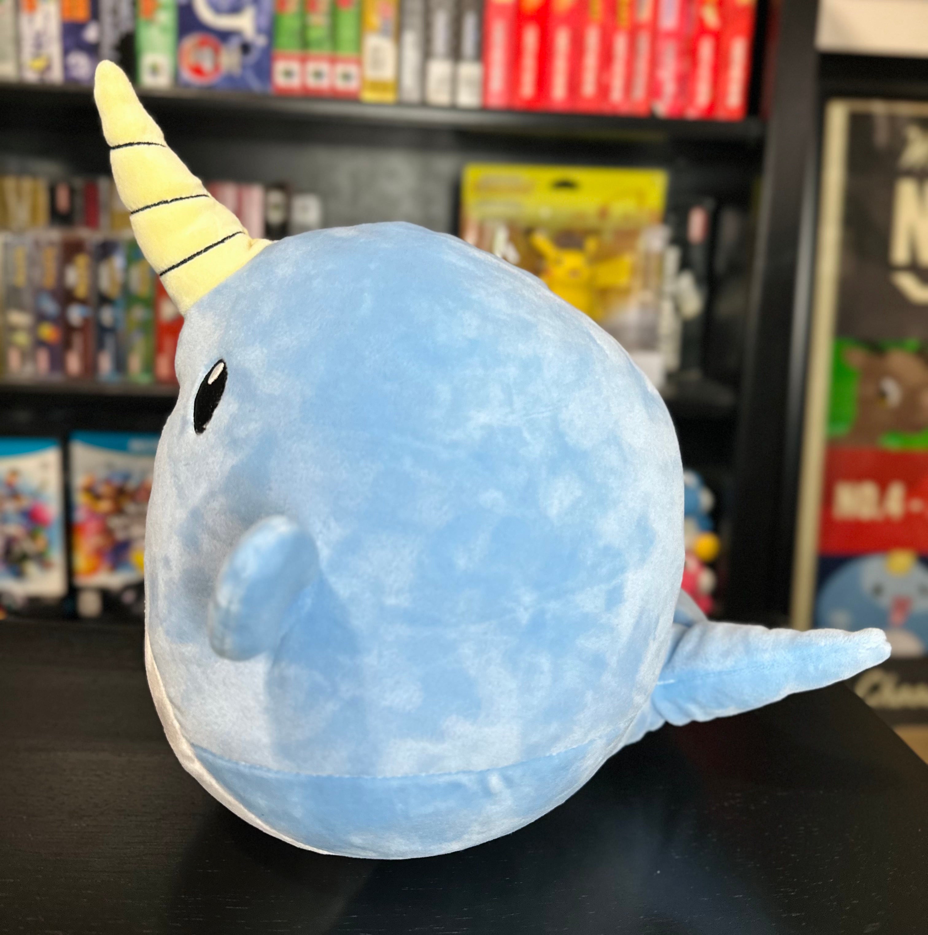 Left side view of Narwade plush from Histrobea Chronicles, showing its blue body and yellow narwhal horn. Designed for fans of HoopsandHipHop's collectible plush toys.